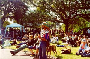 the crowd soaking up the sun and sounds with the NORML/Hempstore stall in the background
